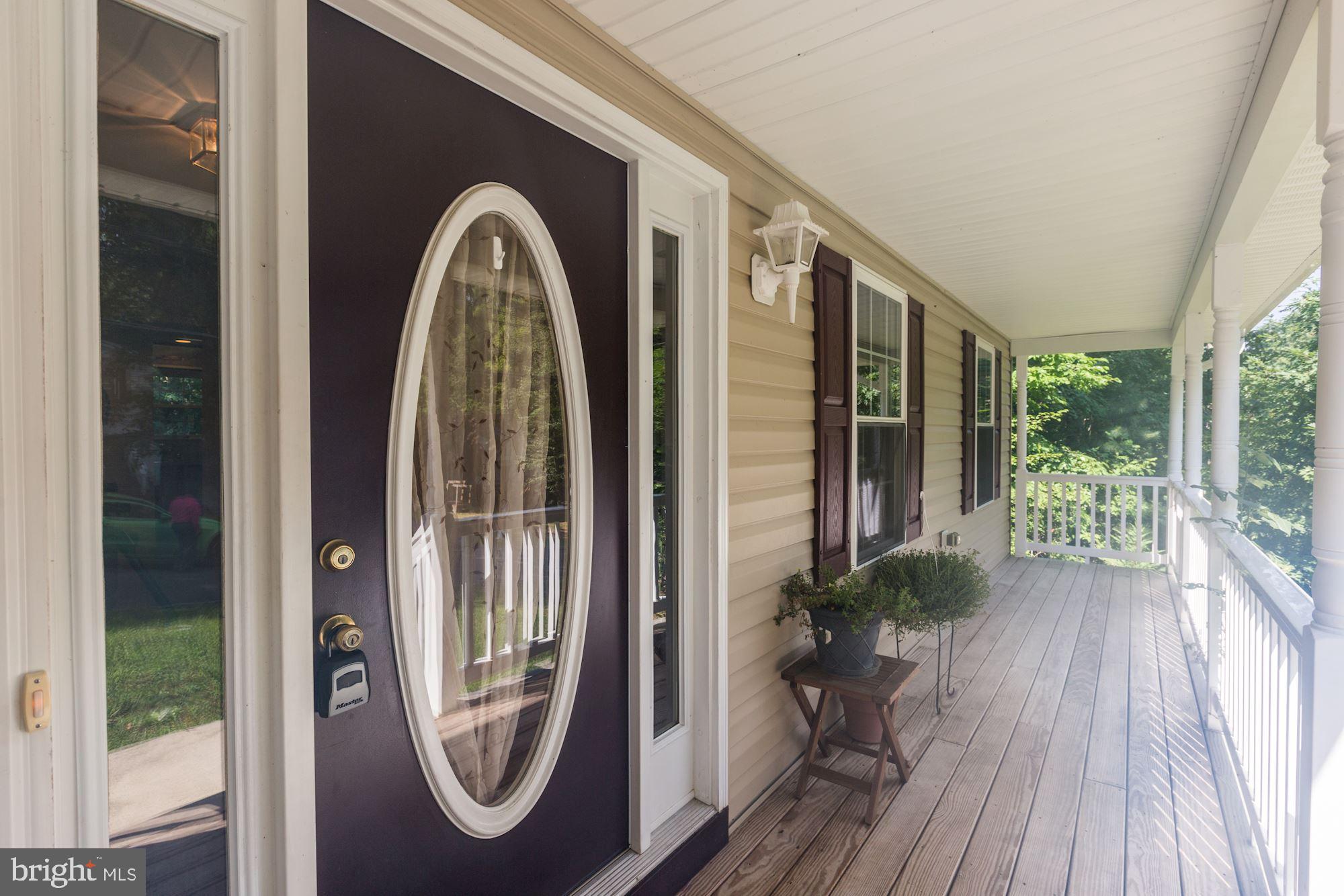 1095 Rimrock Road Lusby, MD 20657 - Photo 3 of 27 Relaxing covered front porch