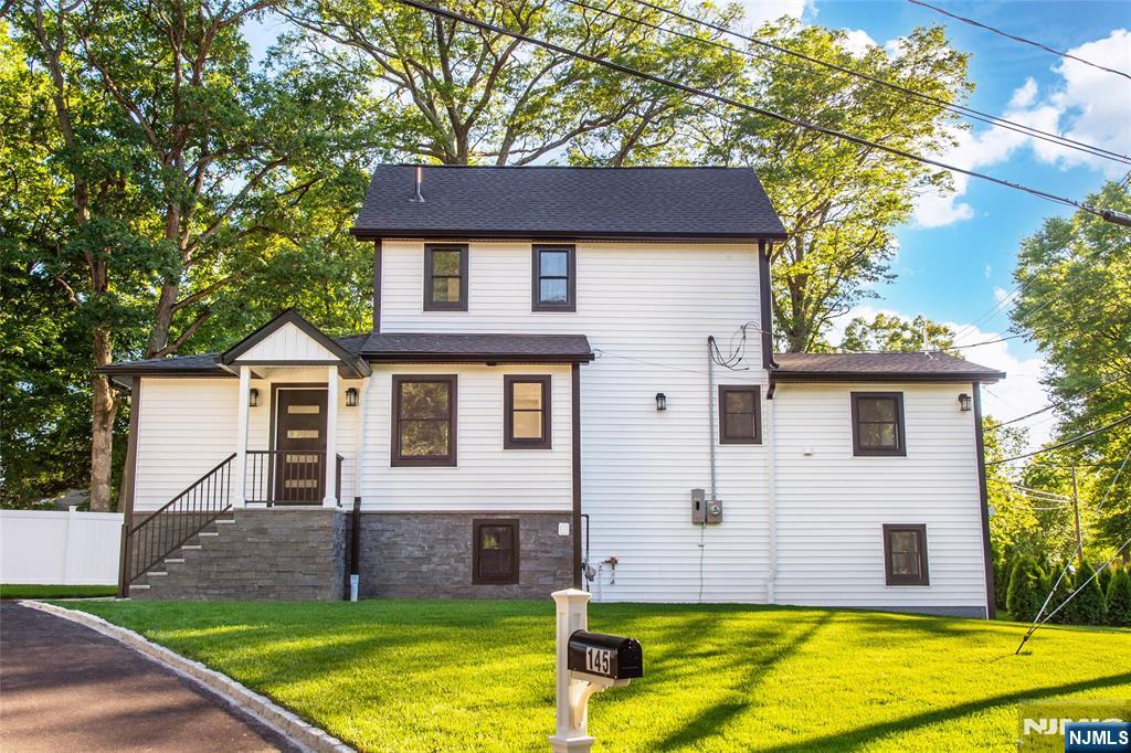 145 Grove Street Mahwah, NJ 07430 - Photo 29 of 30 a front view of a house with a yard