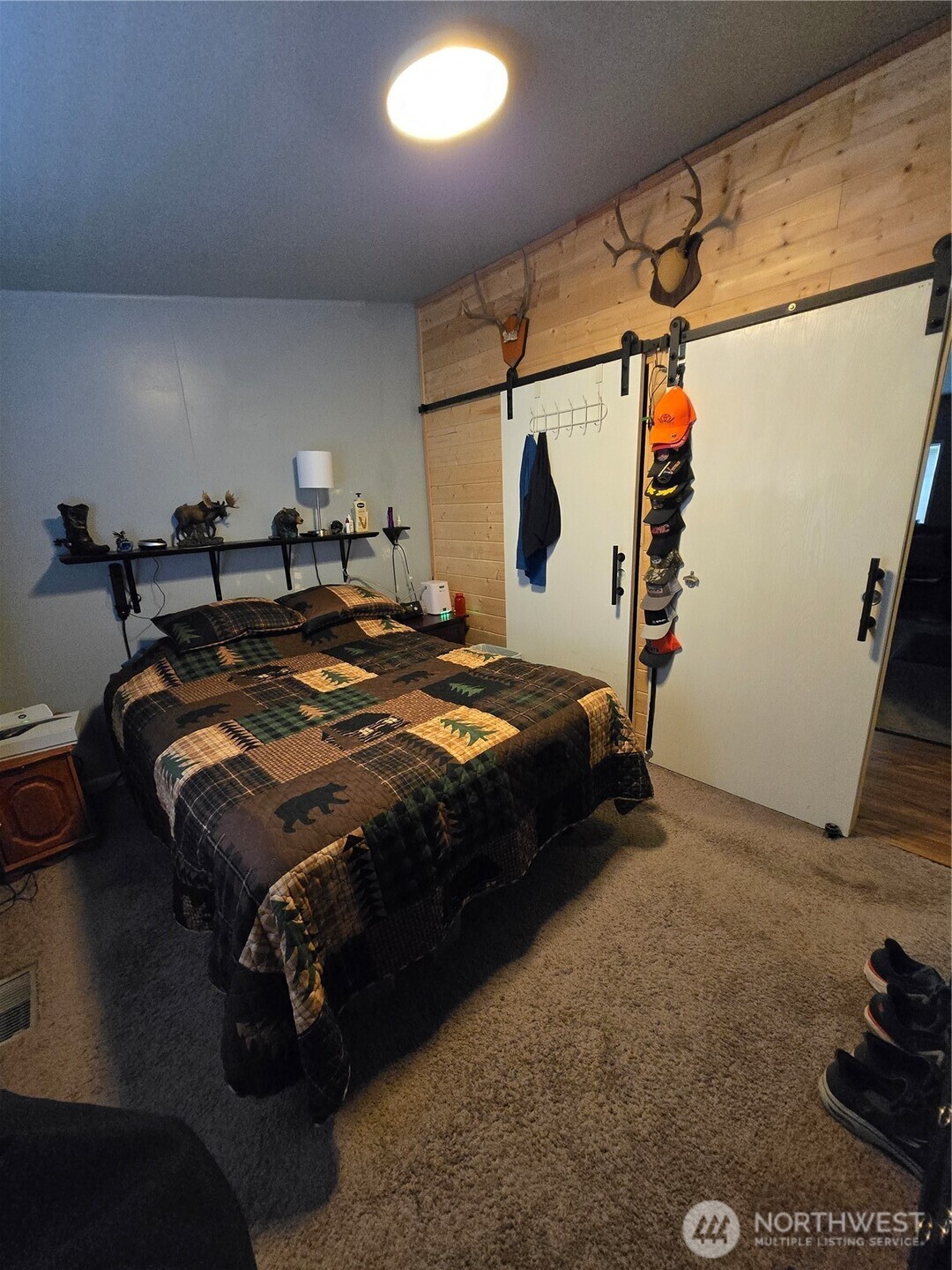 1466 Ferrier Road Winlock, WA 98596 - Photo 13 of 33 a bed sitting in a bedroom next to a window