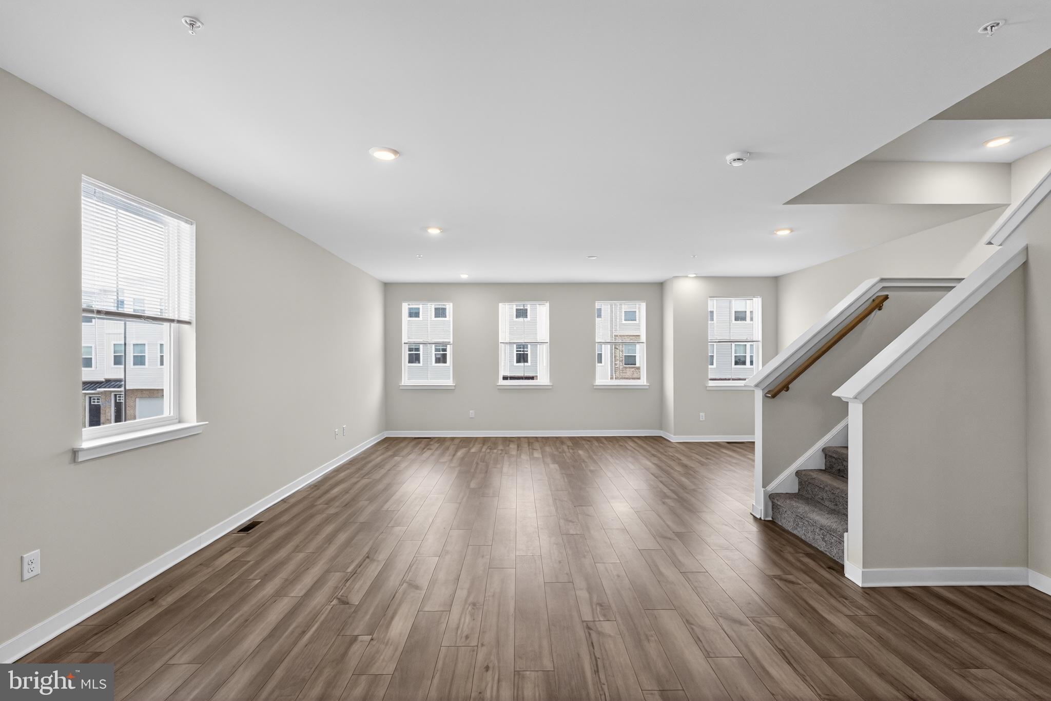 70 Continental Way Bridgeport, PA 19405 - Photo 23 of 30 a view of an empty room with wooden floor and a window