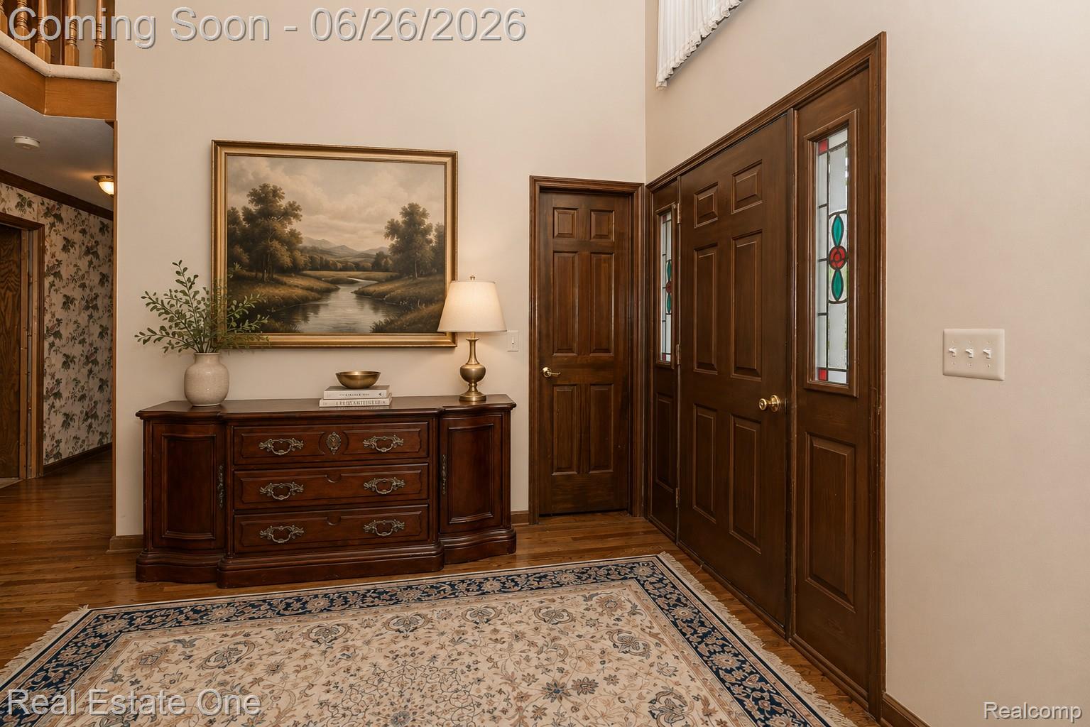 2898 Eagle Drive Rochester, MI 48309 - Photo 3 of 52 Entryway featuring wood-finish flooring, a paneled main door with decorative stained glass sidelights, and a matching secondary door