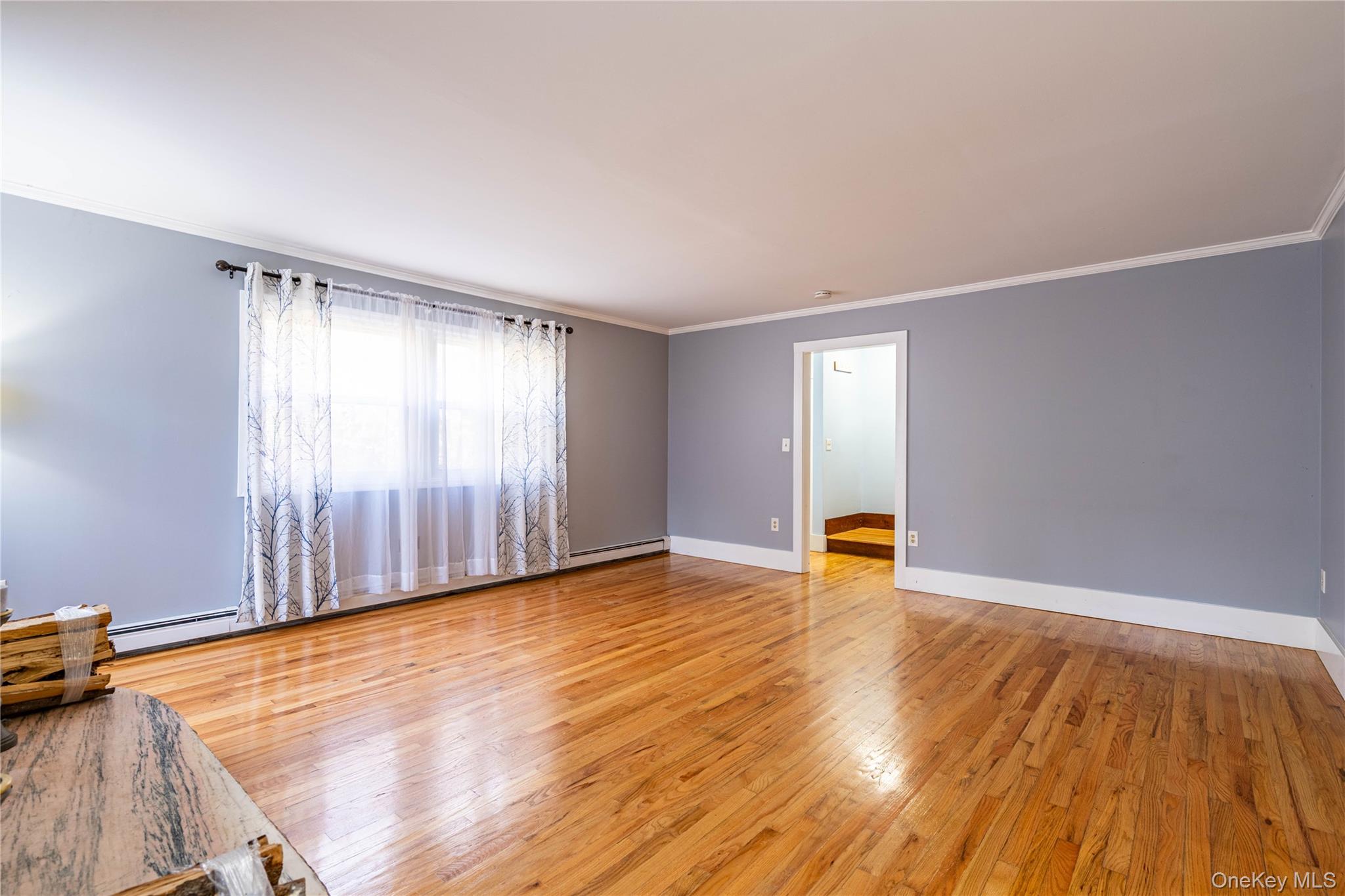 67 Whitlock Road Otisville, NY 10963 - Photo 13 of 50 an empty room with wooden floor and windows