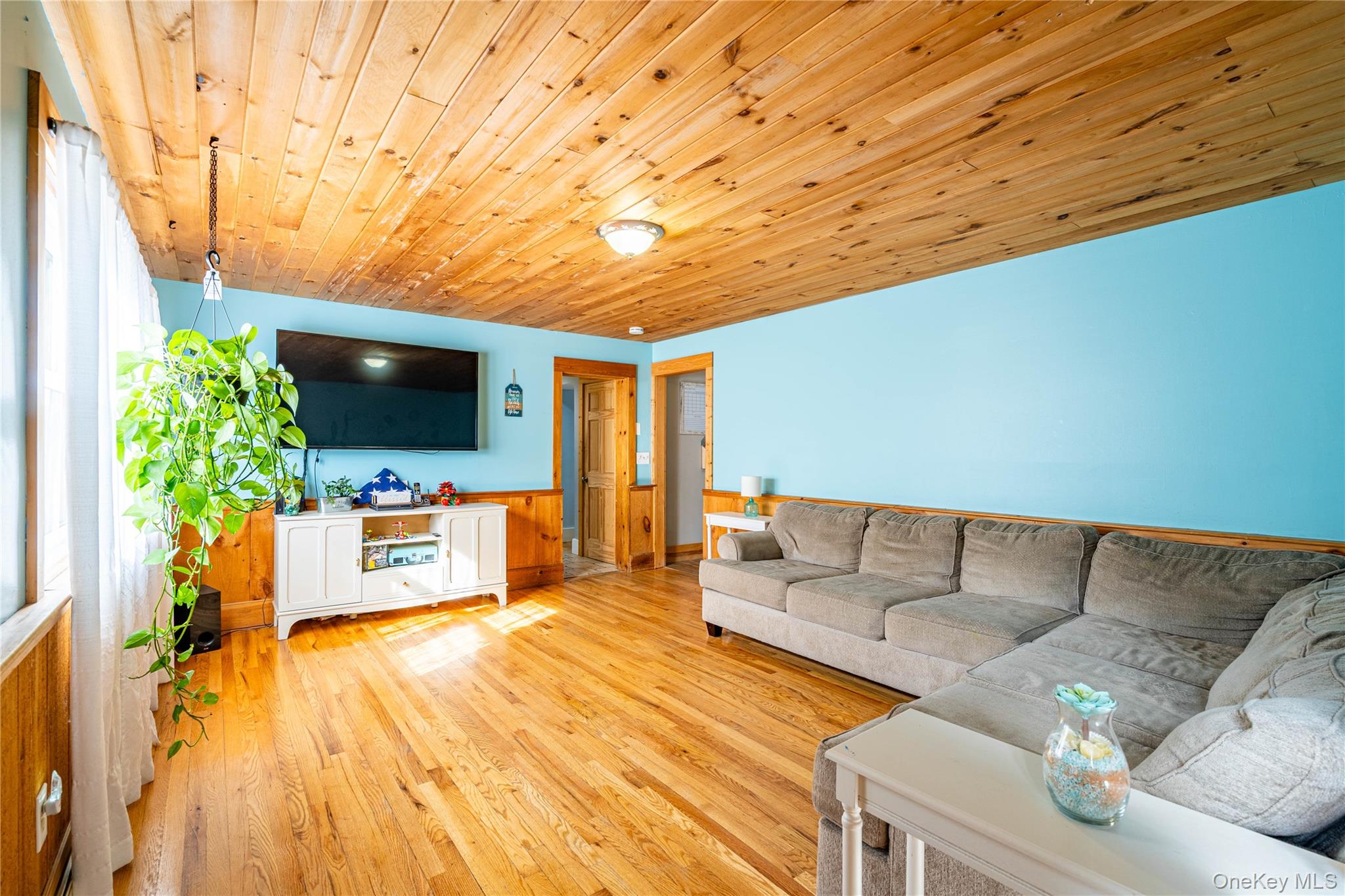 67 Whitlock Road Otisville, NY 10963 - Photo 17 of 50 a living room with furniture and a flat screen tv
