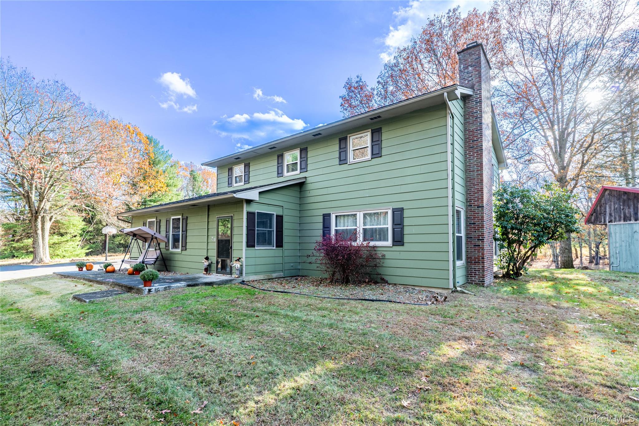 67 Whitlock Road Otisville, NY 10963 - Photo 2 of 50 a view of a house with a yard and sitting area