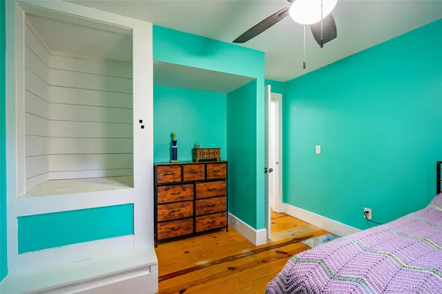 a bedroom with a bed and a dresser