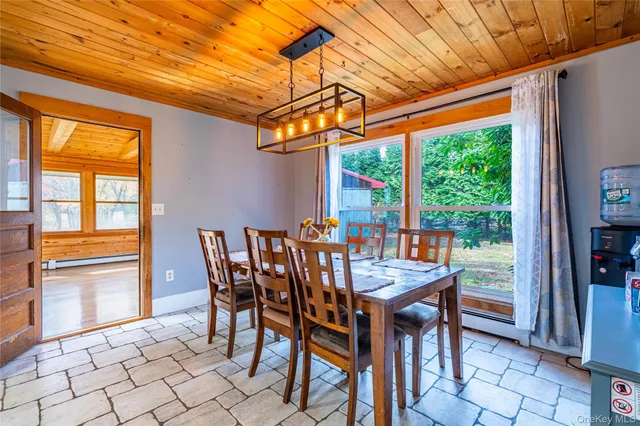 a view of an outdoor dining space with a table and chairs