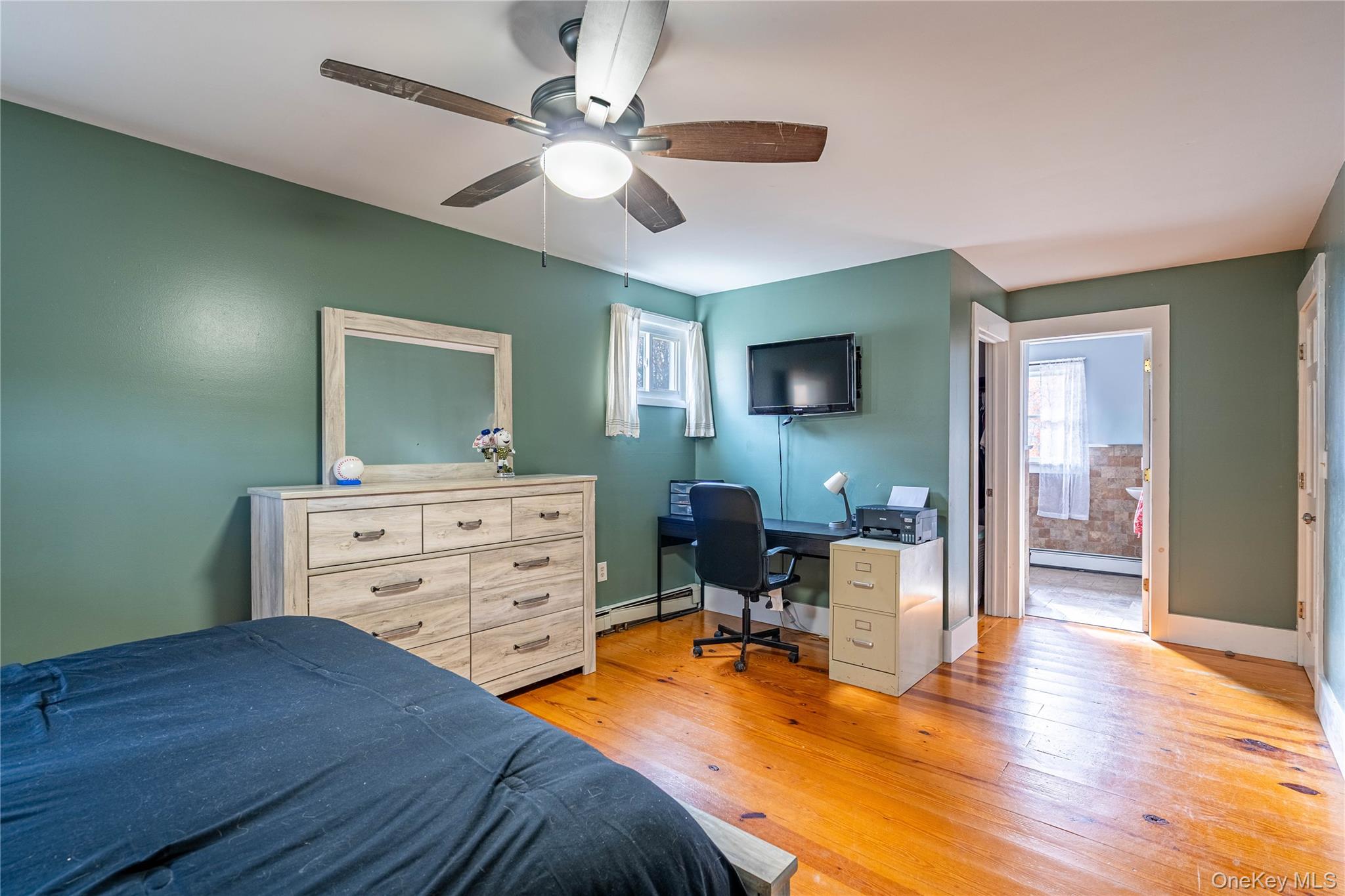 67 Whitlock Road Otisville, NY 10963 - Photo 31 of 50 a bedroom with a bed and a chandelier