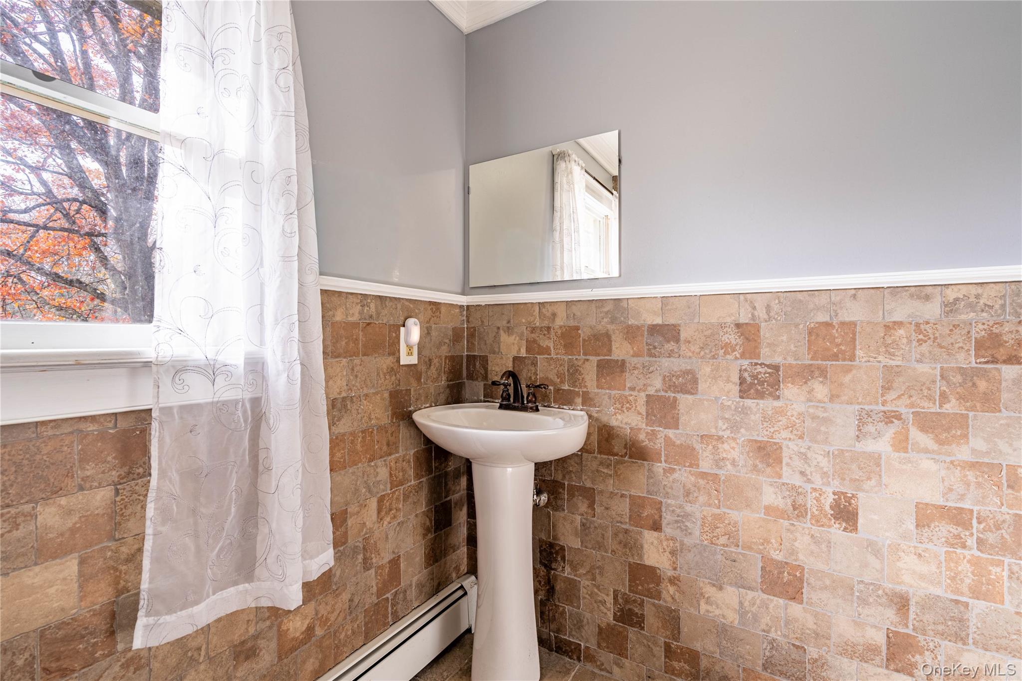 67 Whitlock Road Otisville, NY 10963 - Photo 32 of 50 a bathroom with a sink a mirror and a shower