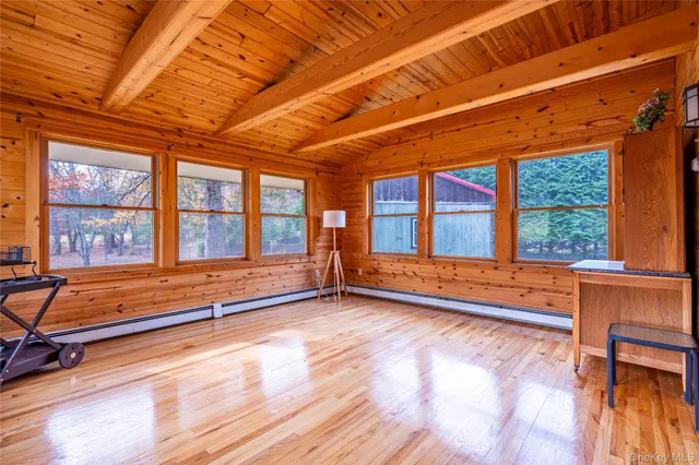 a view of an empty room with windows