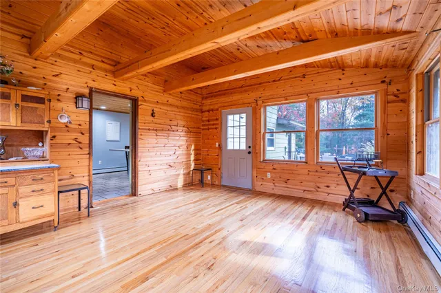 a living room with furniture and a wooden floors