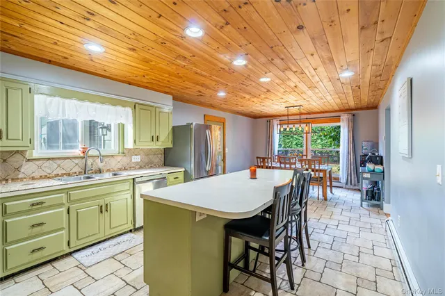 a kitchen with a table and chairs in it