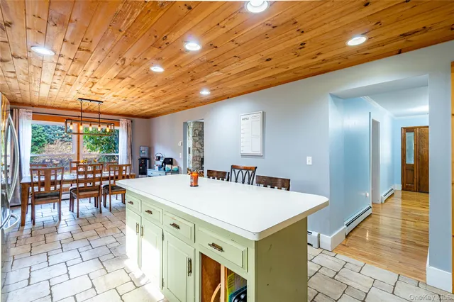 an open kitchen with a table and chairs