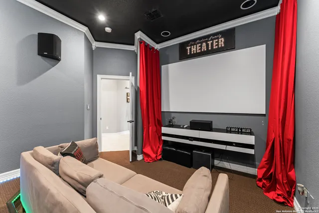 a bedroom with furniture and a flat screen tv