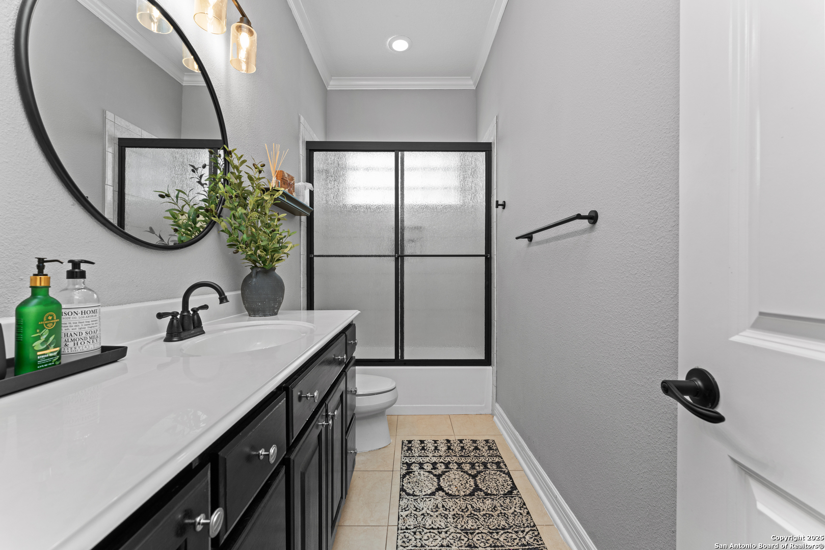 27906 Bogen Road New Braunfels, TX 78132 - Photo 15 of 49 a bathroom with a sink a mirror and a shower