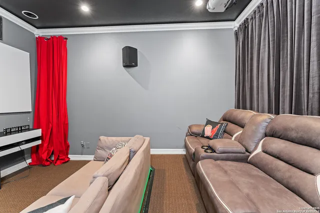 a bedroom with furniture and a flat screen tv