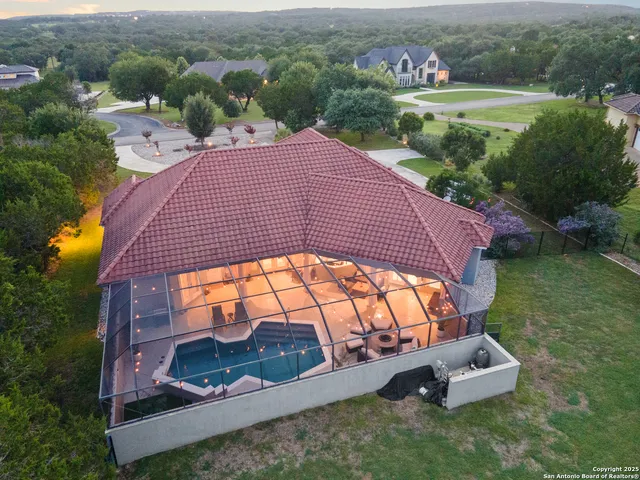 an aerial view of a house with garden