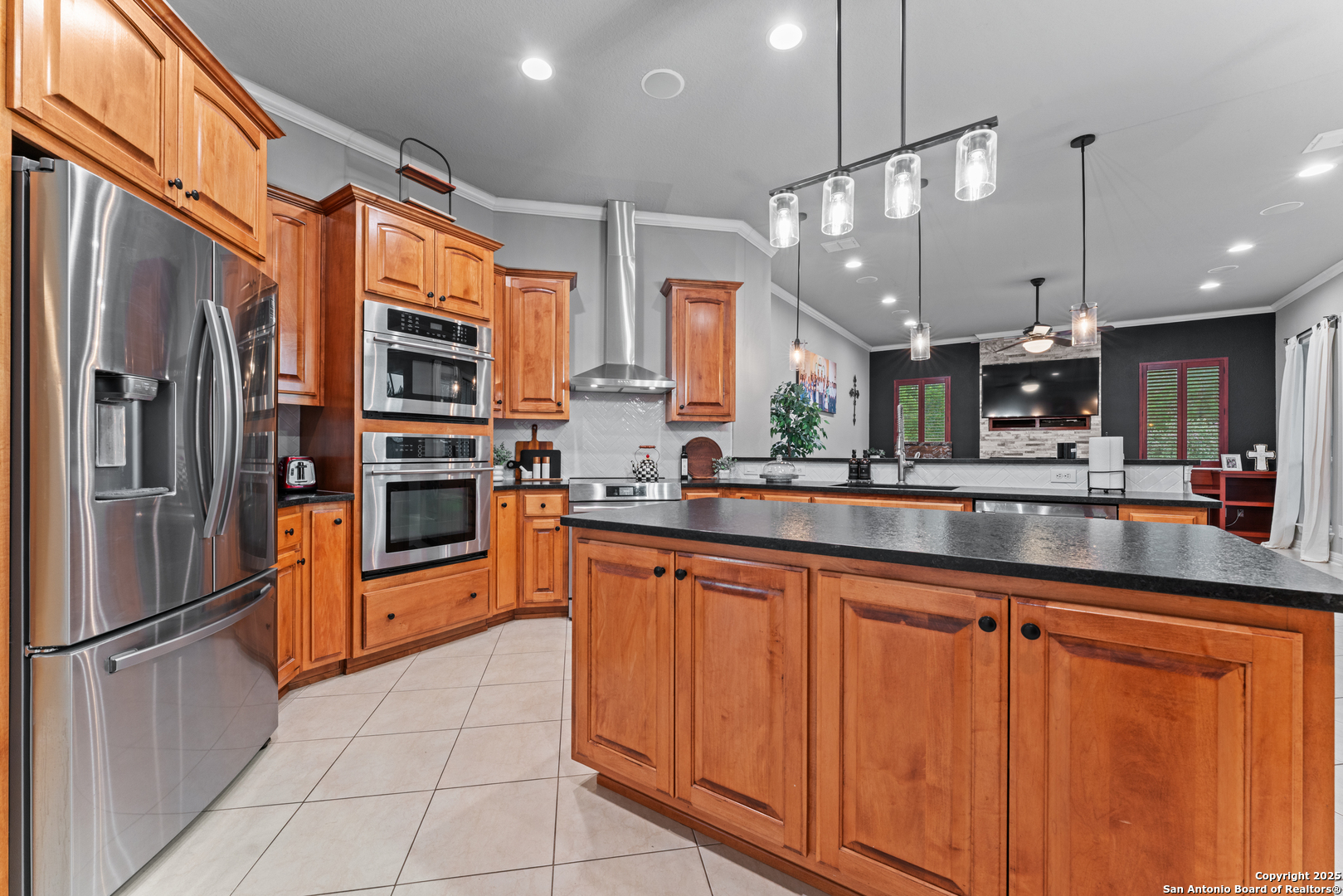 27906 Bogen Road New Braunfels, TX 78132 - Photo 21 of 49 a kitchen with stainless steel appliances granite countertop a refrigerator a oven and a sink