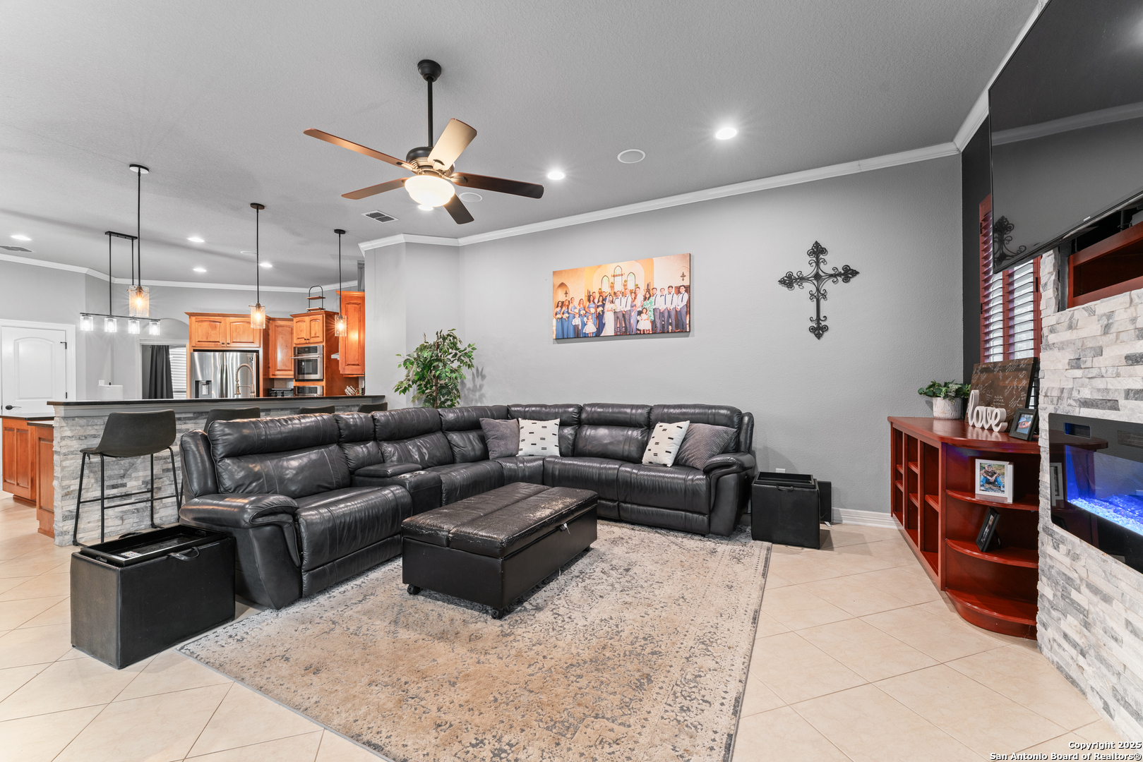27906 Bogen Road New Braunfels, TX 78132 - Photo 26 of 49 a living room with furniture kitchen view and a chandelier