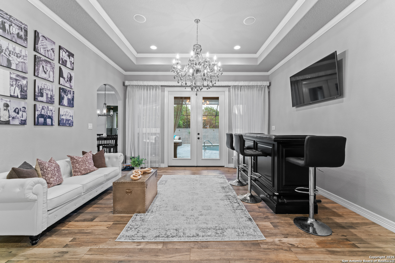 27906 Bogen Road New Braunfels, TX 78132 - Photo 30 of 49 a living room with furniture and a chandelier