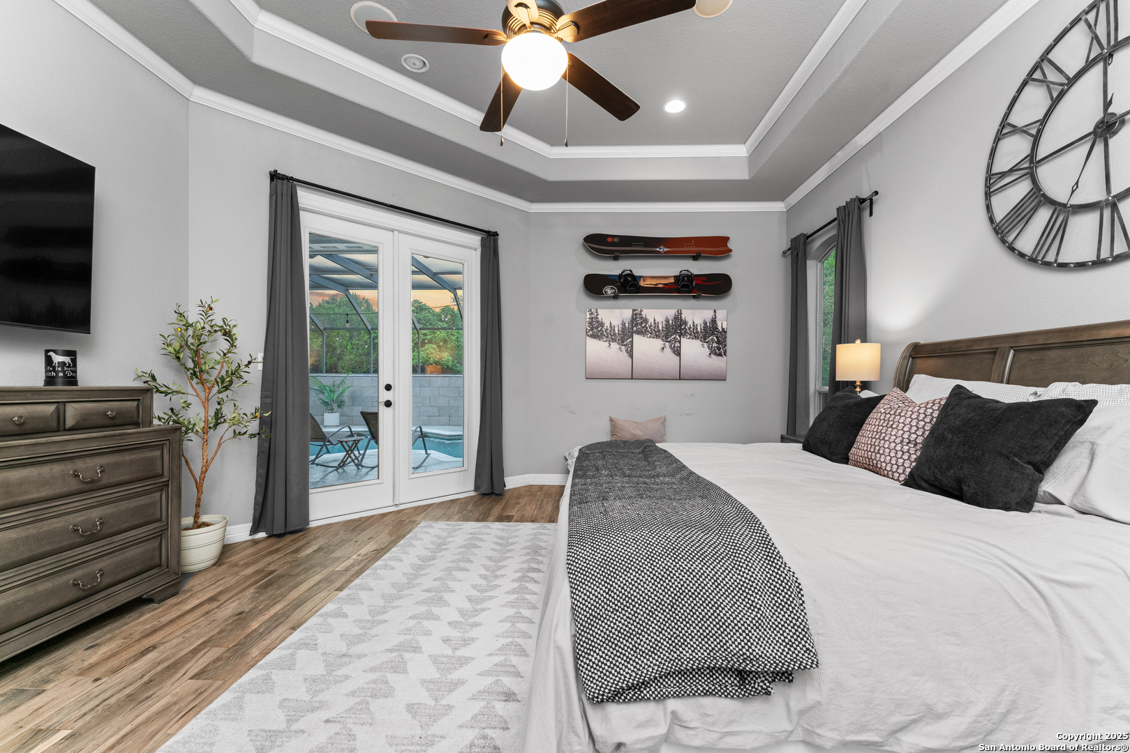 27906 Bogen Road New Braunfels, TX 78132 - Photo 33 of 49 a bedroom with a large bed and a flat screen tv