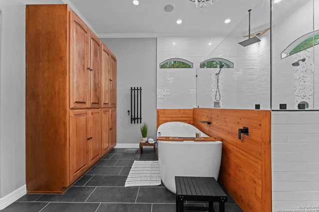 a bathroom with a sink a mirror and shower