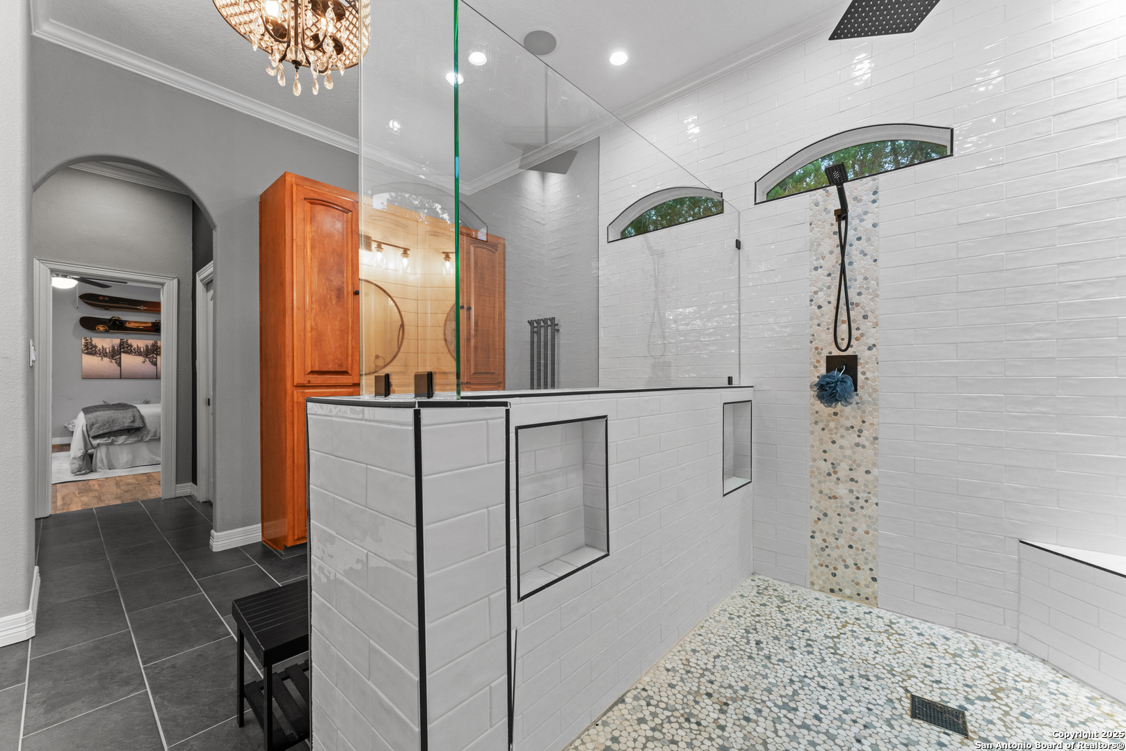 27906 Bogen Road New Braunfels, TX 78132 - Photo 37 of 49 a bathroom with a shower a sink and a mirror