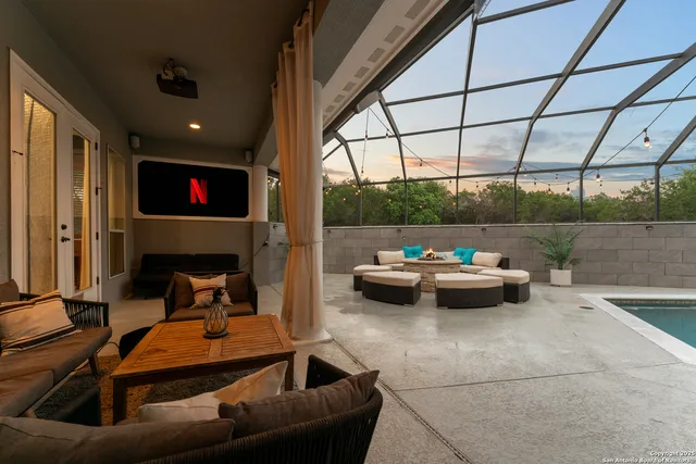 a view of swimming pool with outdoor seating and yard