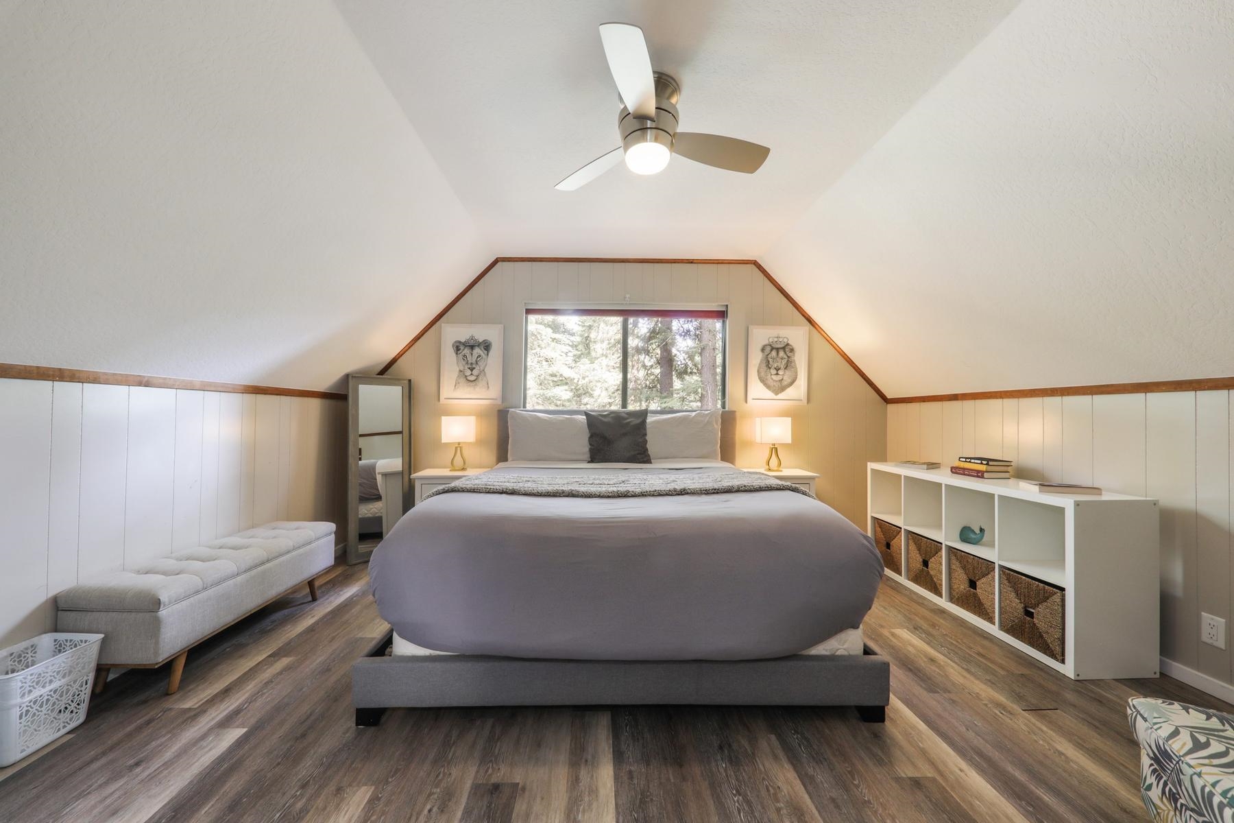 5656 Victoria Road Carnelian Bay, CA 96140 - Photo 16 of 28 a bedroom with a bed and a window