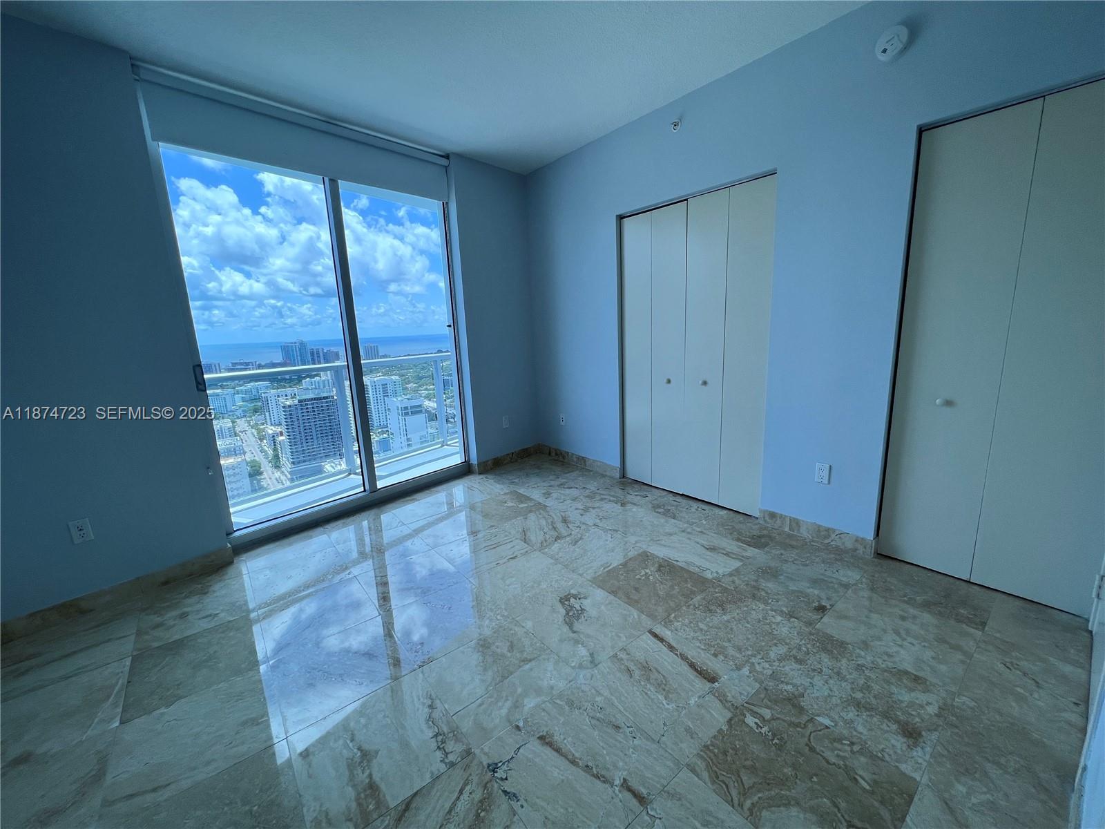 185 Southwest 7th Street, Unit 4204 Miami, FL 33130 - Photo 11 of 32 a view of an empty room with windows