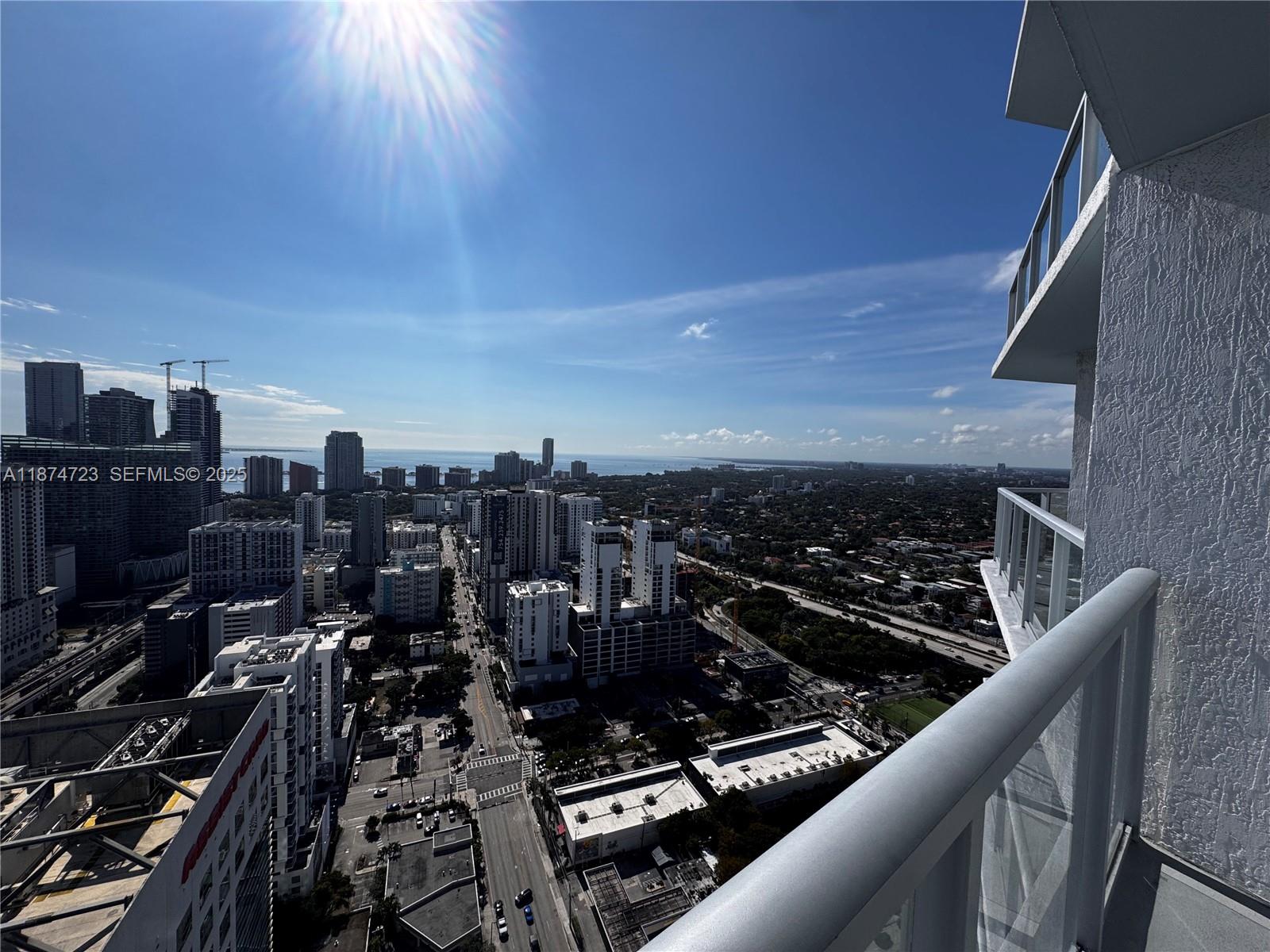 185 Southwest 7th Street, Unit 4204 Miami, FL 33130 - Photo 22 of 32 a city view from a balcony