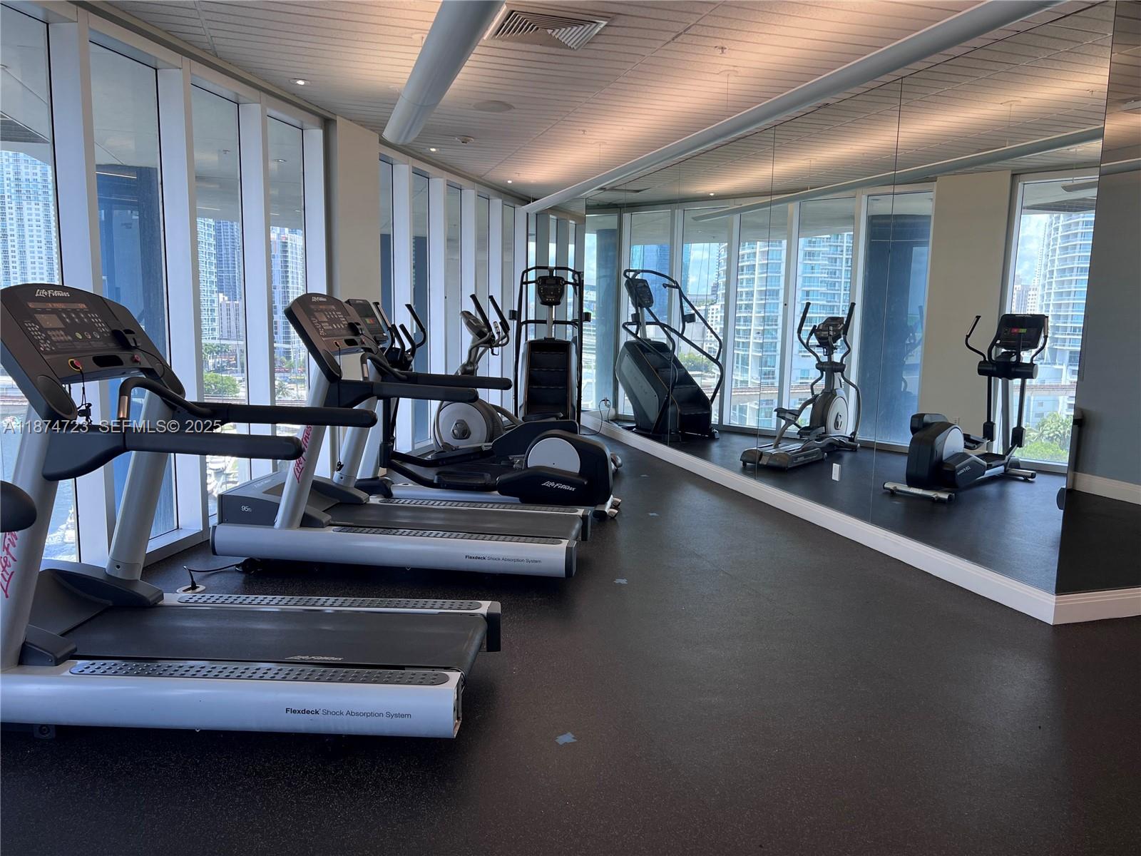 185 Southwest 7th Street, Unit 4204 Miami, FL 33130 - Photo 25 of 32 a view of a room with gym equipment