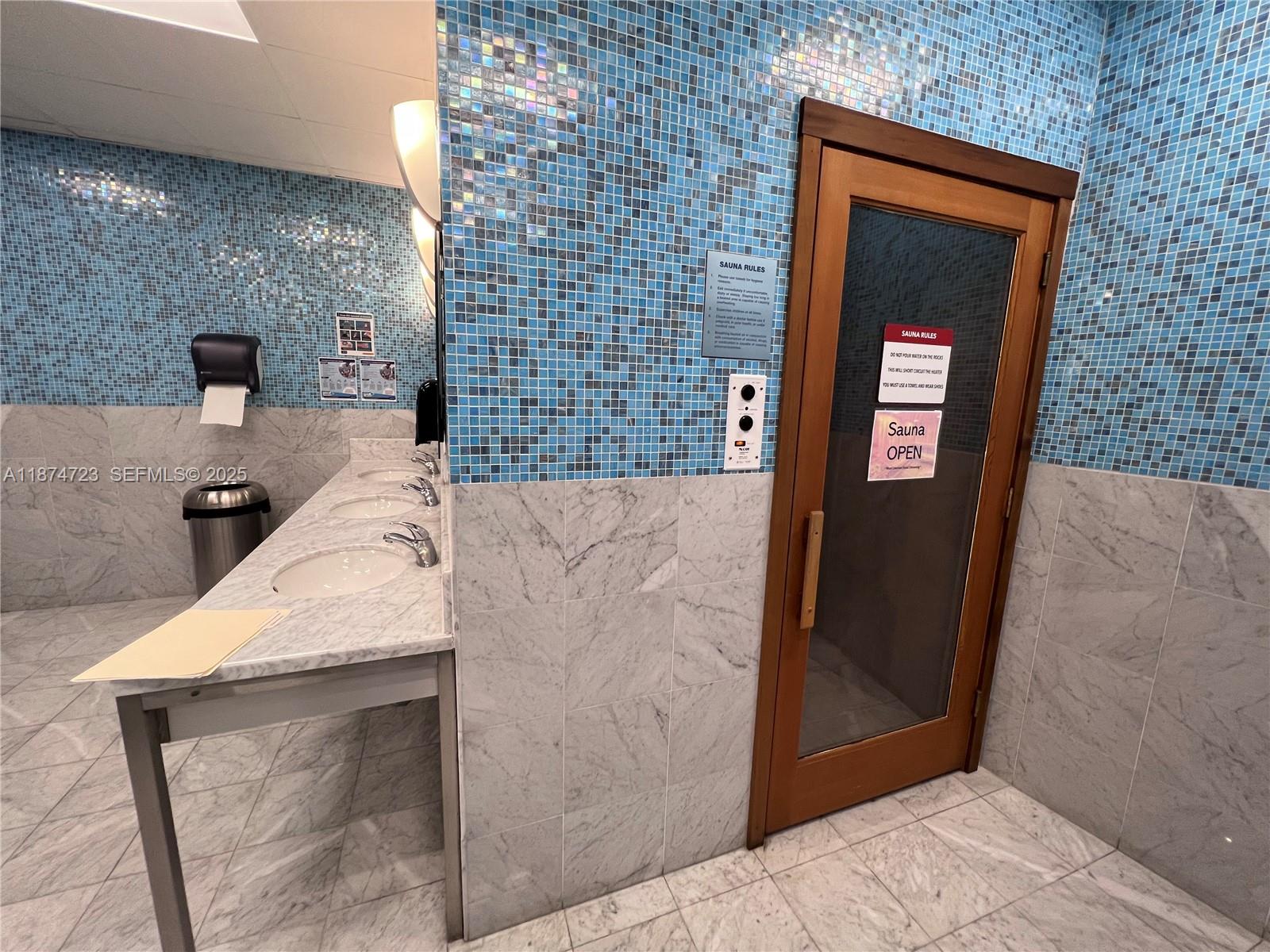 185 Southwest 7th Street, Unit 4204 Miami, FL 33130 - Photo 27 of 32 a bathroom with a sink and mirror