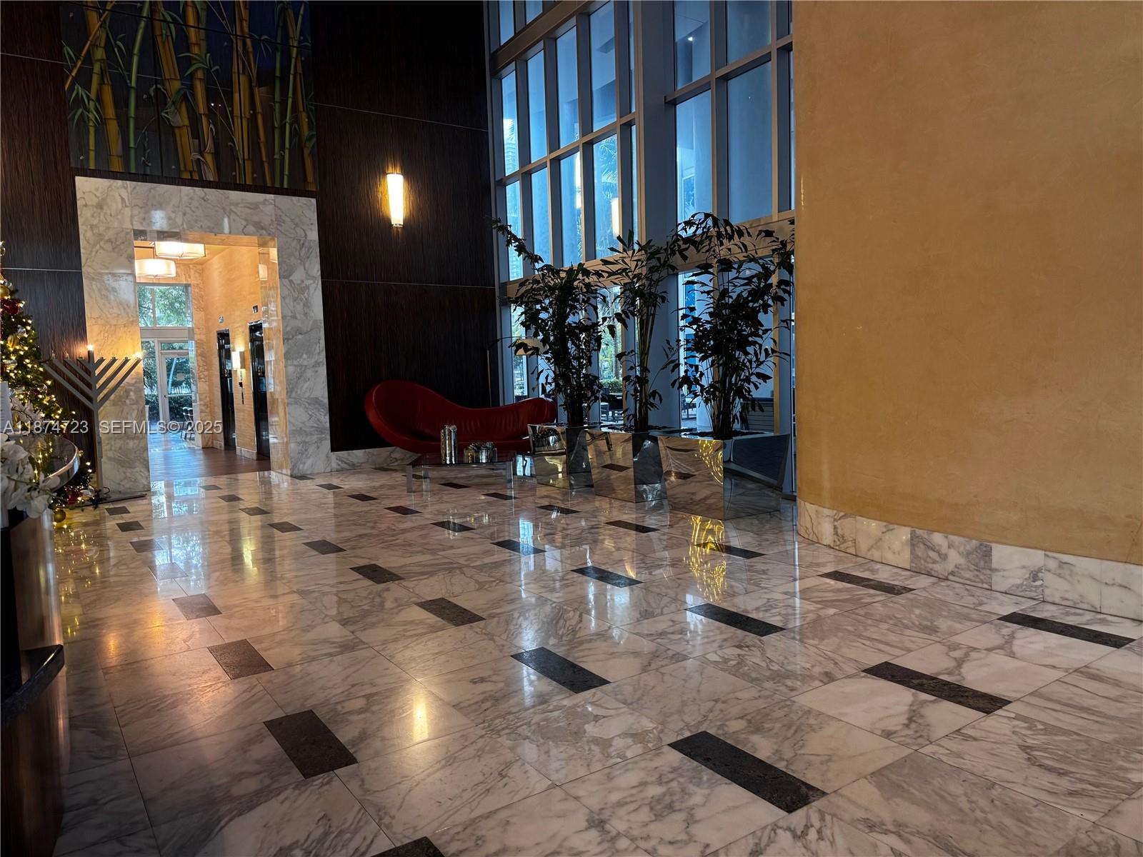 185 Southwest 7th Street, Unit 4204 Miami, FL 33130 - Photo 30 of 32 a dining room with lots of wooden furniture and a view of living room