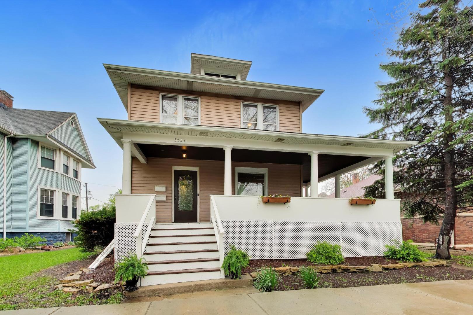 3533 Grand Boulevard Brookfield, IL 60513 - Photo 1 of 40 a front view of a house with a garden