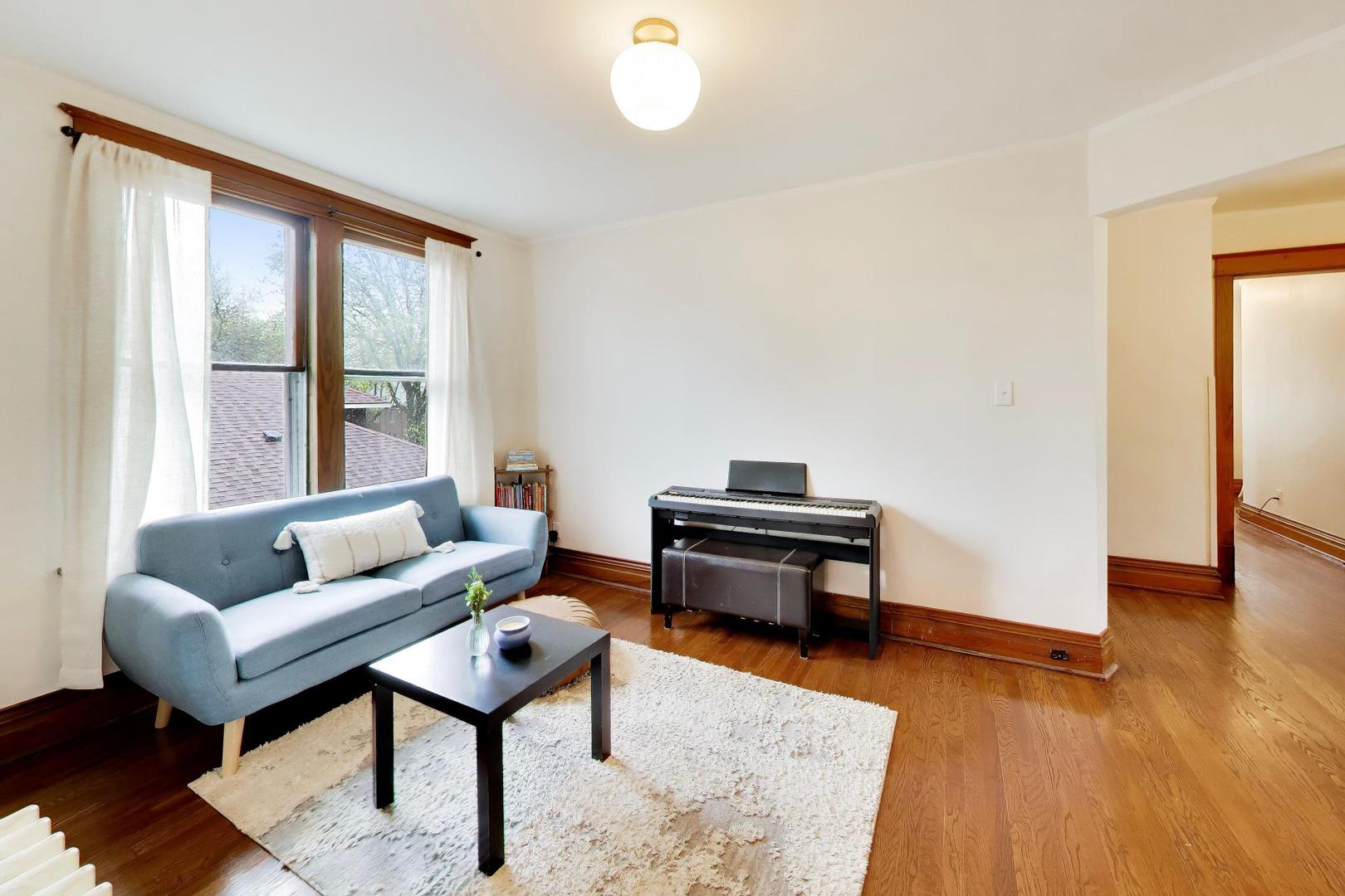 3533 Grand Boulevard Brookfield, IL 60513 - Photo 20 of 40 a living room with furniture a rug and a large window