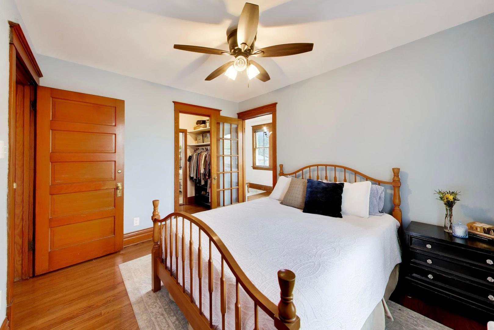 3533 Grand Boulevard Brookfield, IL 60513 - Photo 22 of 40 a bedroom with a bed and wooden floor