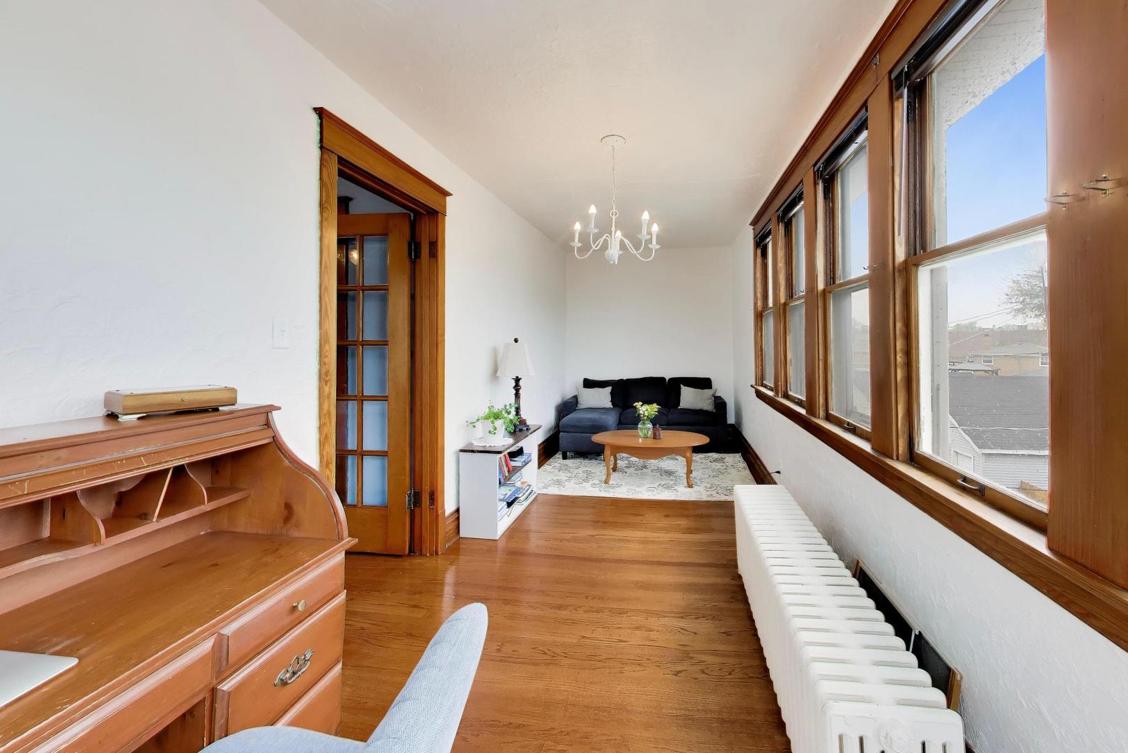 3533 Grand Boulevard Brookfield, IL 60513 - Photo 23 of 40 a view of a balcony with a couch and wooden floor