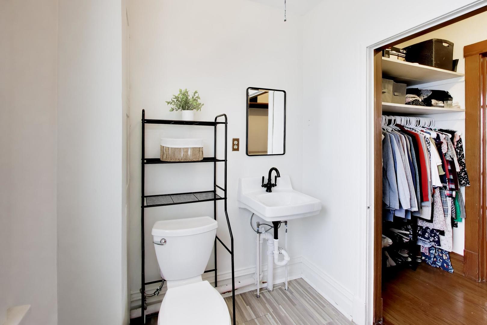 3533 Grand Boulevard Brookfield, IL 60513 - Photo 25 of 40 a bathroom with a toilet sink and mirror