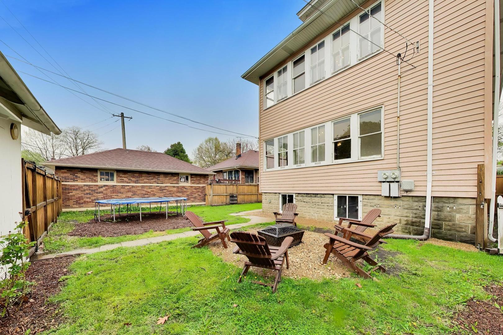 3533 Grand Boulevard Brookfield, IL 60513 - Photo 34 of 40 a view of a patio with table and chairs under an umbrella