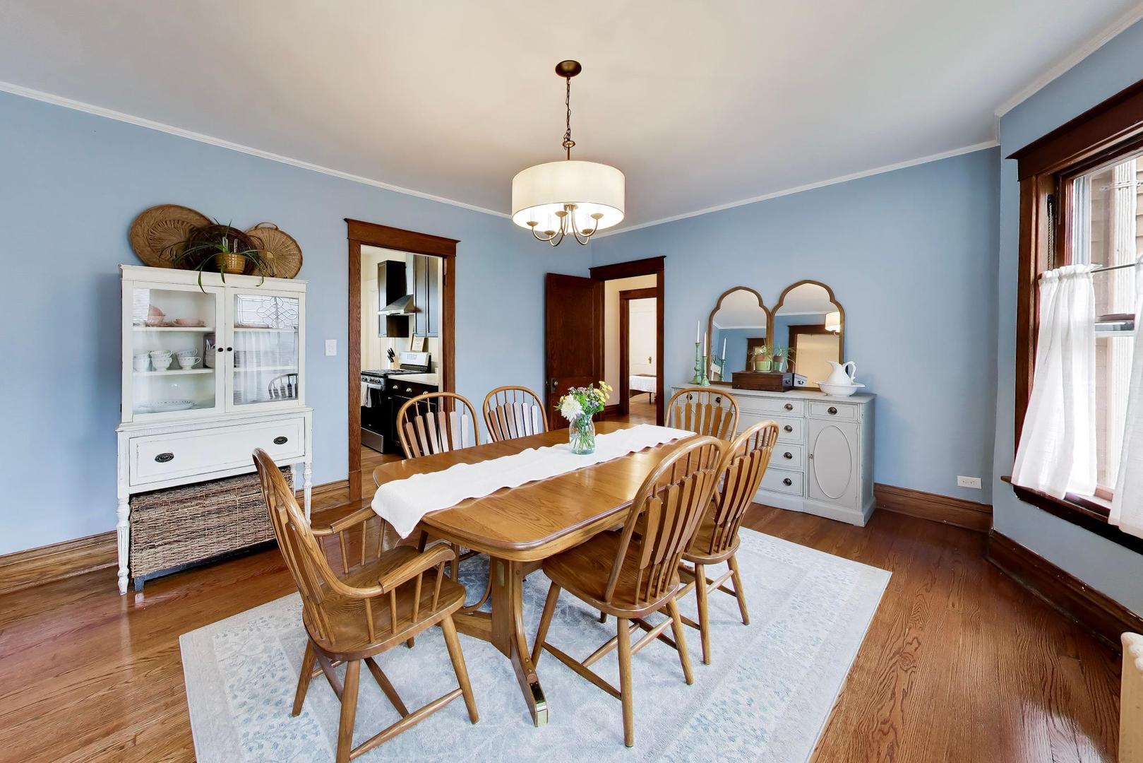 3533 Grand Boulevard Brookfield, IL 60513 - Photo 8 of 40 a view of a dining room with furniture window and wooden floor