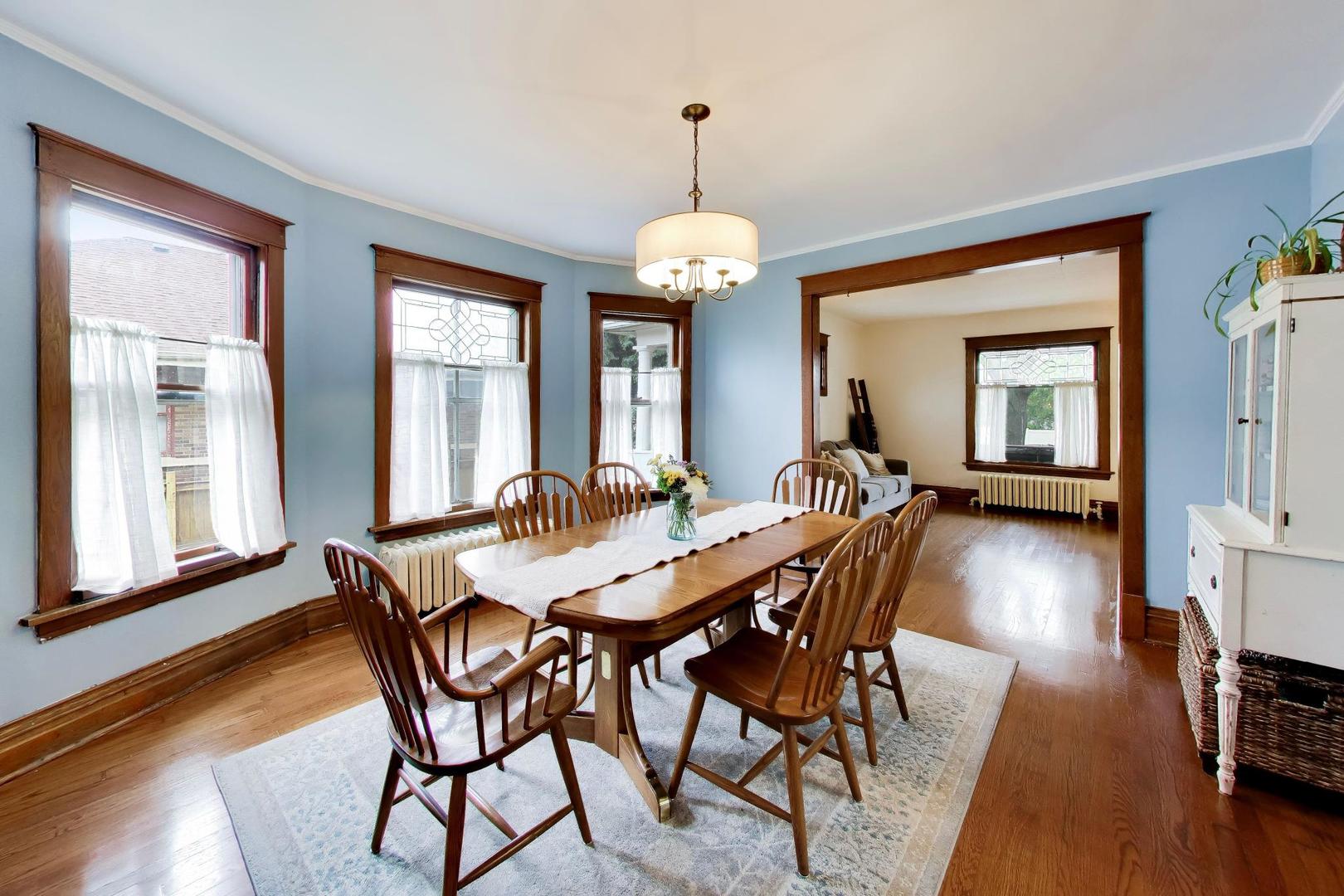3533 Grand Boulevard Brookfield, IL 60513 - Photo 9 of 40 a view of a dining room with furniture window and wooden floor
