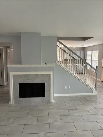 a view of staircase with fireplace