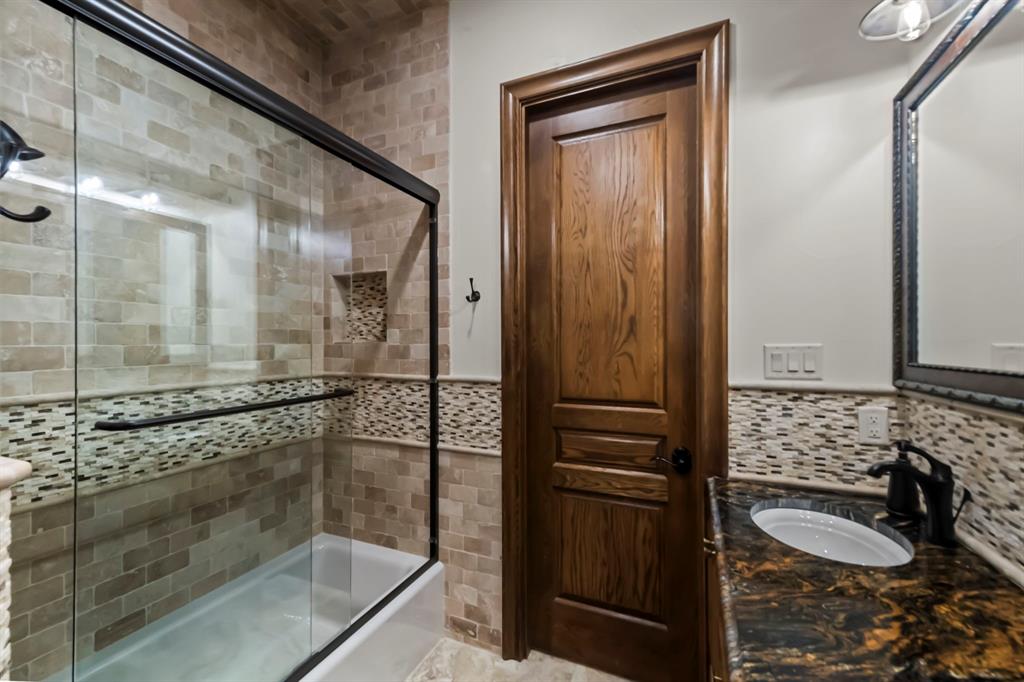 1025 Pecan Ridge Graford, TX 76449 - Photo 20 of 40 Beautiful tile and woodwork in primary bath