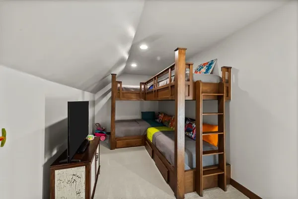 a kitchen with a stove a sink and cabinets