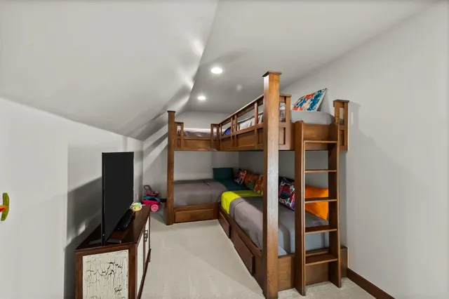 a kitchen with a stove a sink and cabinets