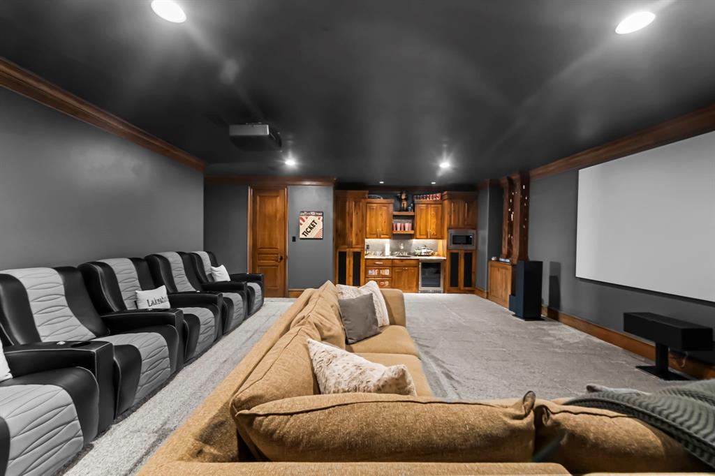 1025 Pecan Ridge Graford, TX 76449 - Photo 32 of 40 Professional quality thater/ gaming room with wet bar and POPCORN!