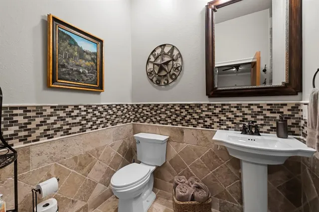a living room with furniture and floor to ceiling windows