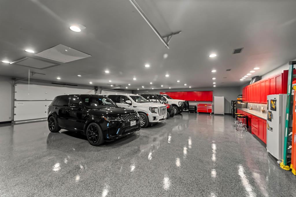 1025 Pecan Ridge Graford, TX 76449 - Photo 37 of 40 Huge climate controlled primary garage with built ins and epoxy floor
