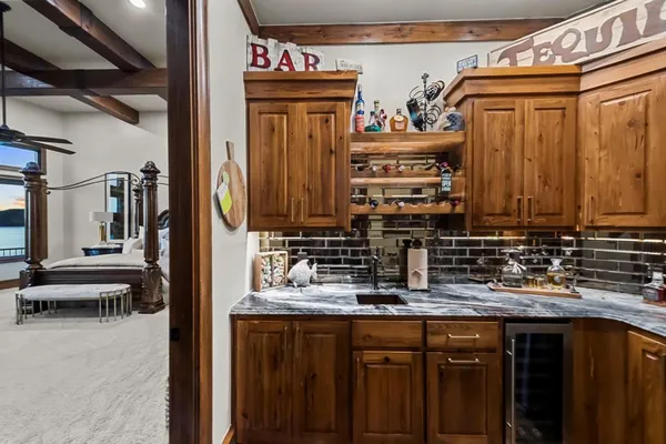 a kitchen with a refrigerator and sink