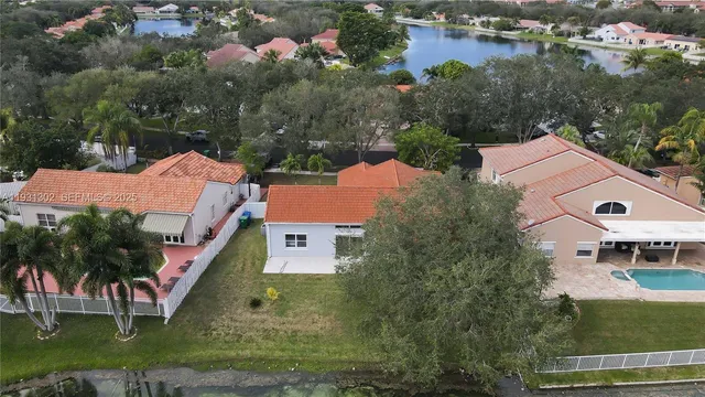 an aerial view of a house with outdoor space